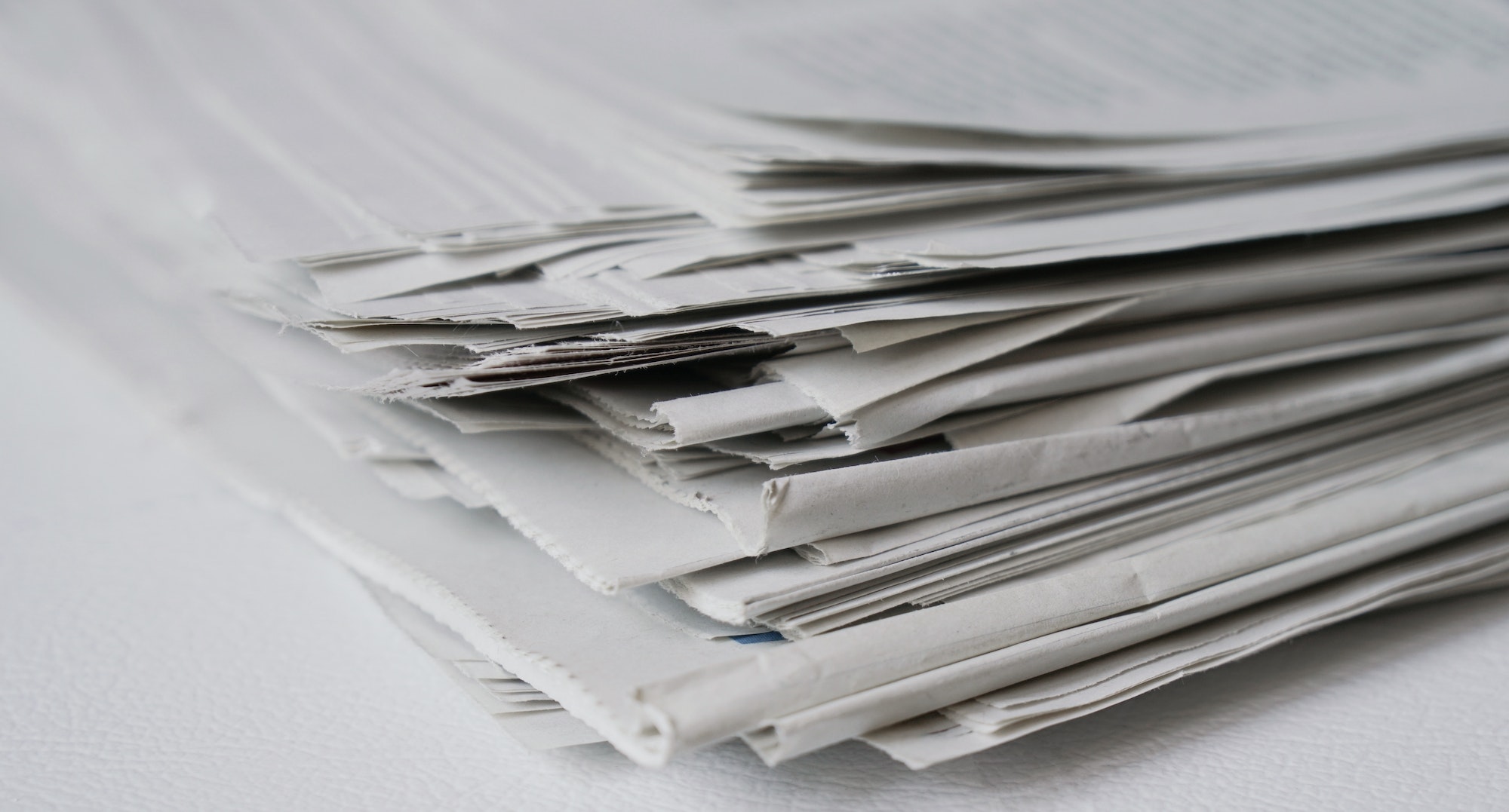 close-up of a pile of newspaper as a news and media concept